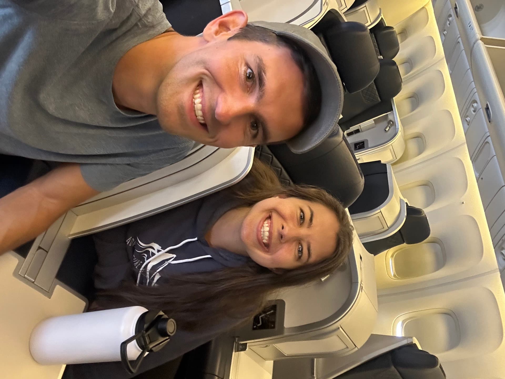 Azores Airlines Comfort Class cabin on a flight from Boston, with 2-2 recliner seats in dark blue leather